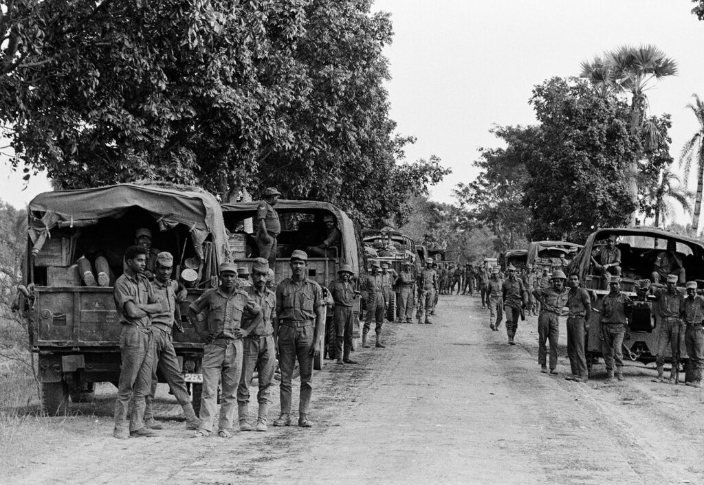 pakistan army soldiers standing besides military vehicles during east pakistan campaign of the indo pakistani war 19714165808593427072683